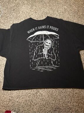 Men's Black Graphic Tee with 'When It Rains It Pours' Skeleton Design
